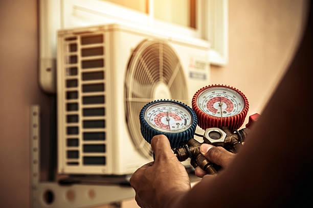 Professional Air Conditioning Service technician working in Evans, CO